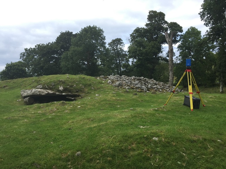 Laser scanning equipment on a tripod outside a burial cairn