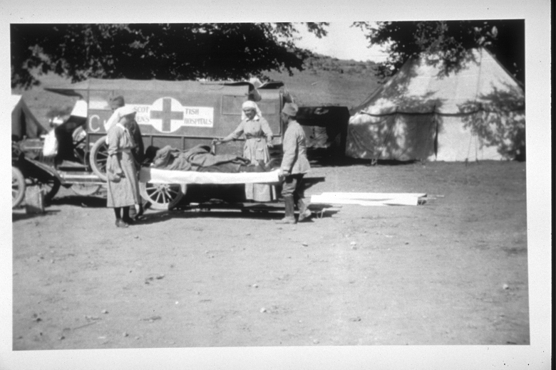 A black and white archive photo of female stretcher bearers at work in a field hospital