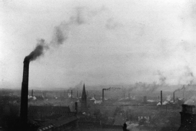 skyline with Victorian factories belching out smoke