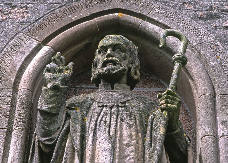 A statue of St Columba with a shepherd's crook