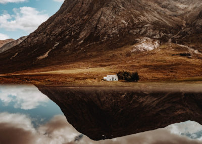 Scottish landscape with a small bothy in front of a loch