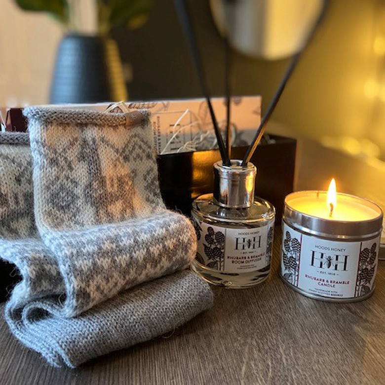 gift set, including socks, a candle and diffuser.