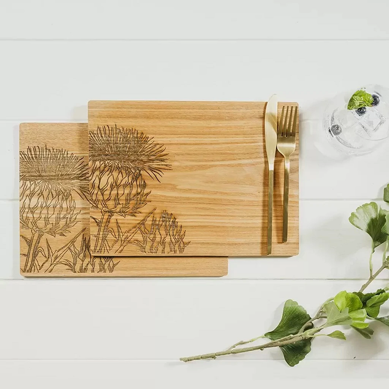 wooden placemats etched with thistles