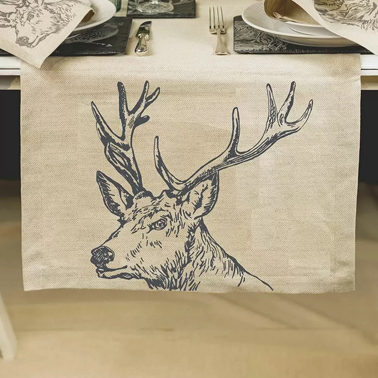 table cloth with stag design on it