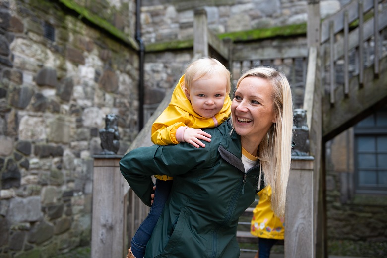 A woman and a toddler exploring a castle