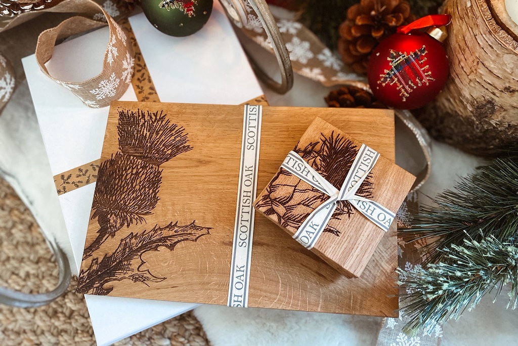 a photo showing christmas gift products iincluding placemats and coasters with thistles on them
