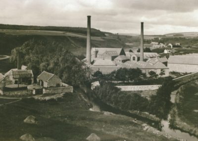 Black and white photograph of a spinning mill.