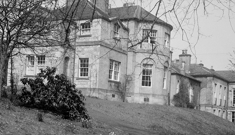 Black and white image showing a Georgian country mansion