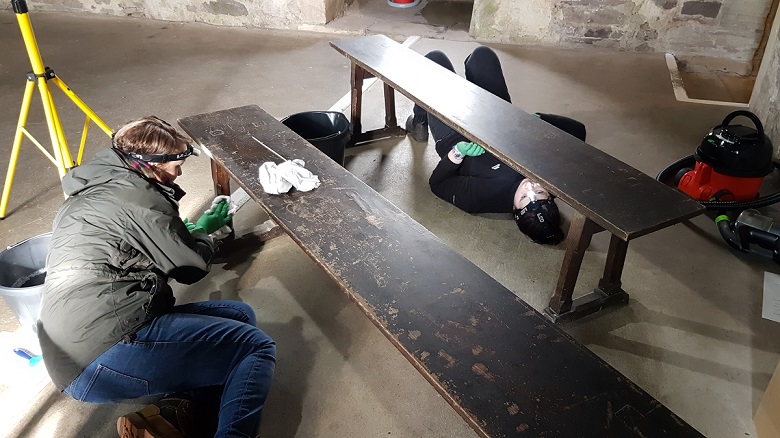 HES staff working on oak benches during winter cleaning at castle 