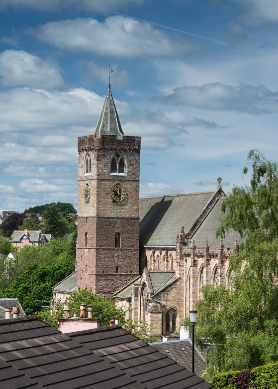 The tower of Dunblane Cathedral viewed over rooftops