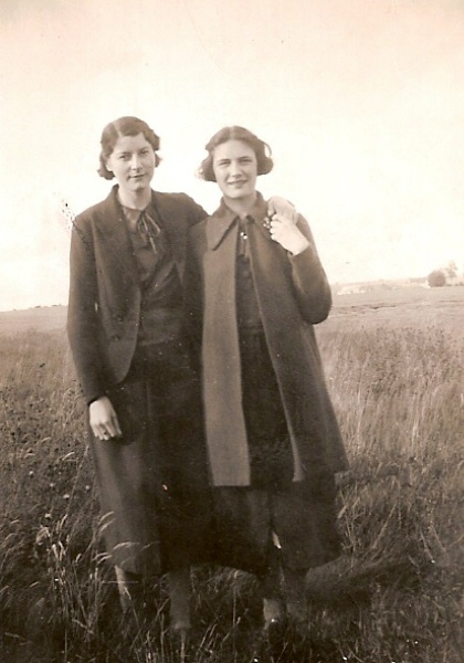 An archive photo of two young women posing together 