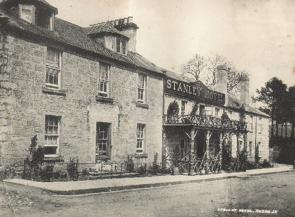 An archive photo of a hotel on a village street 
