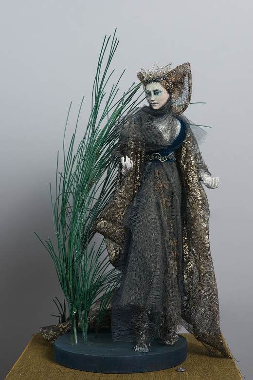 A model of a fairy queen who features in many of the Borders ballads hiding among blades of grass