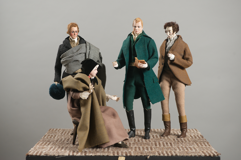 A scene created from small dolls showing three men listening to an older, seated lady performing one of her Border Ballads