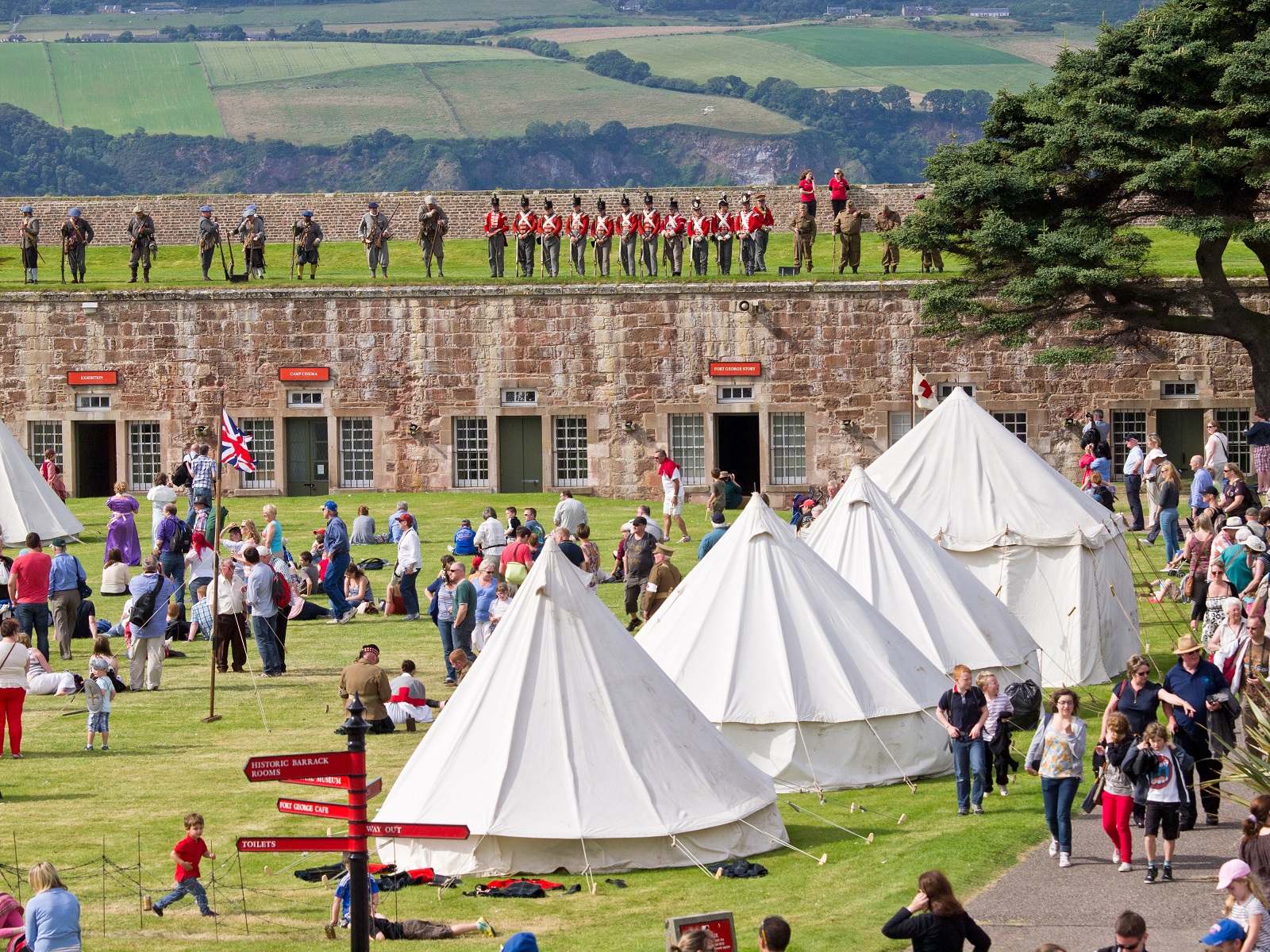 A drone image of Fort George during the Celebration of the Centuries event showing tents and groups of people