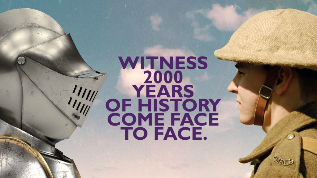 Close-up of person dressed as a knight and a person dressed as a soldier looking at each other. There is large text in the space between them which reads: "Witness 2000 years of history come face to face"