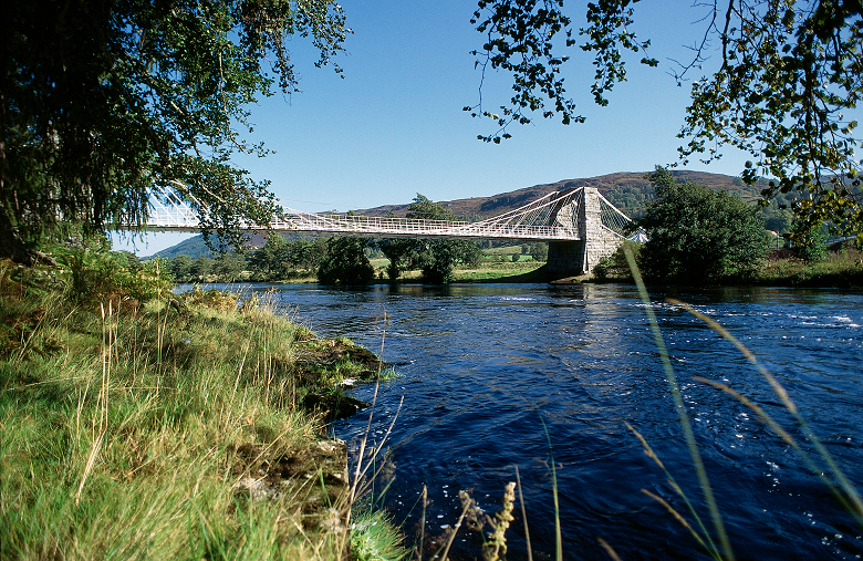 A historic suspension bridge spanning a river