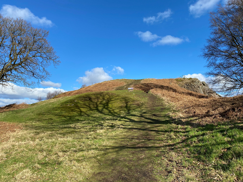 A path leading to the flat summit of a small hill