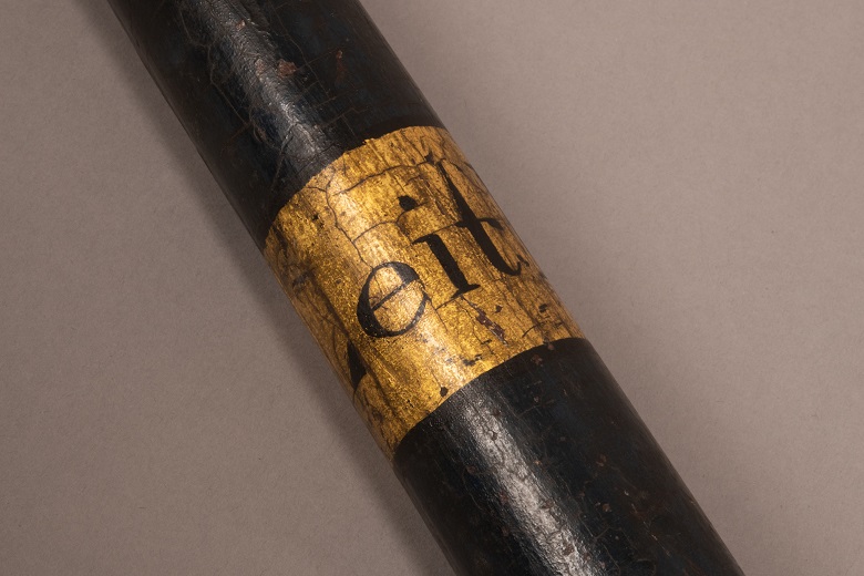 Lettering on a baton reading "Leith"