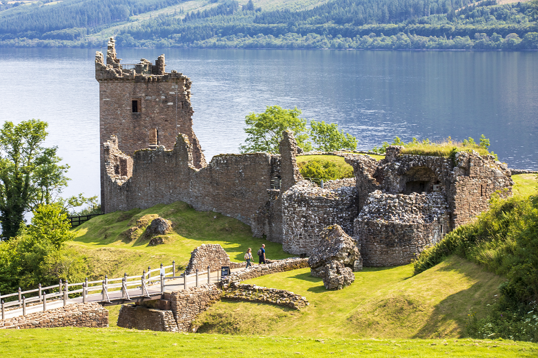 The picturesque ruins of a castle beside a loch