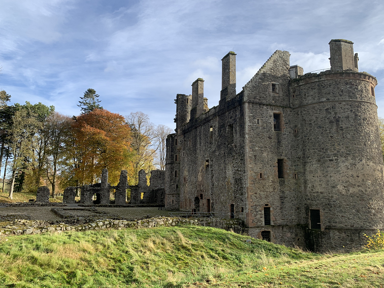 Huntly Castle in an autumnal landscape.