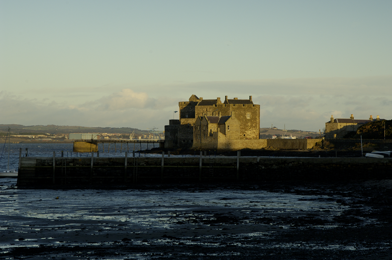 Distant view of Blackness Castle against an autumnal sky.