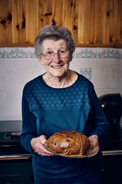 Aunt Bellag photographed in her kitchen with her clootie dumpling