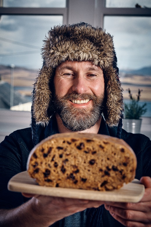 The Hebridean Baker holds up a completed clootie dumpling