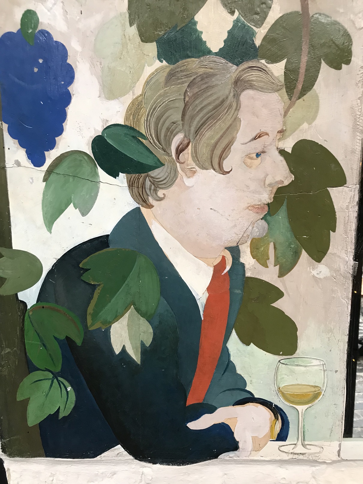 A close up of a person drinking wine as part of the Alasdair Gray mural at the Ubiquitous Chip
