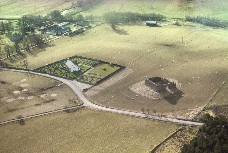 An aerial view of the ruins of Castle Roy surrounded by farmland