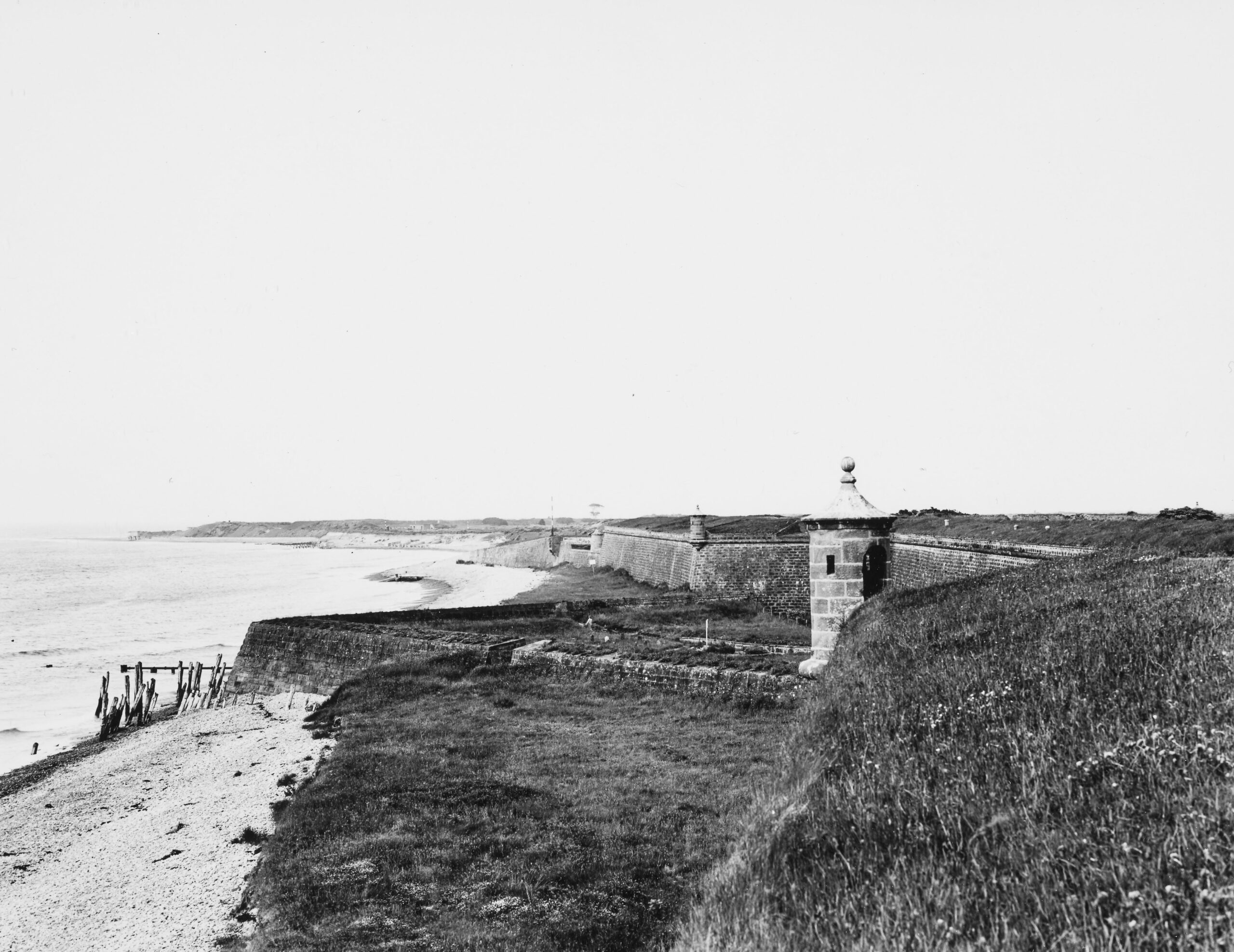 A black and white photo of the lonely ramparts of Fort George, where the climax of The Wraith at Fort George is set