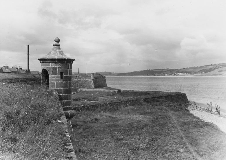 An archive photo of the ramparts at Fort George with a small watchtower looking out to sea