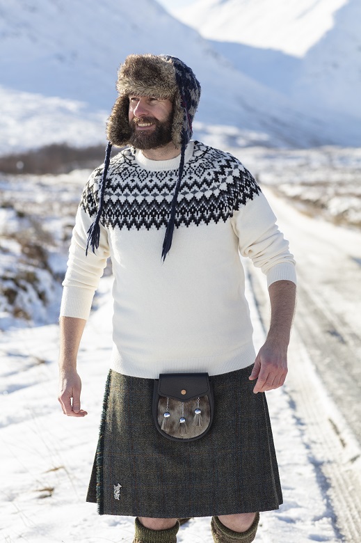 The Hebridean Baker wearing a kilt, sporran and knitted jumper