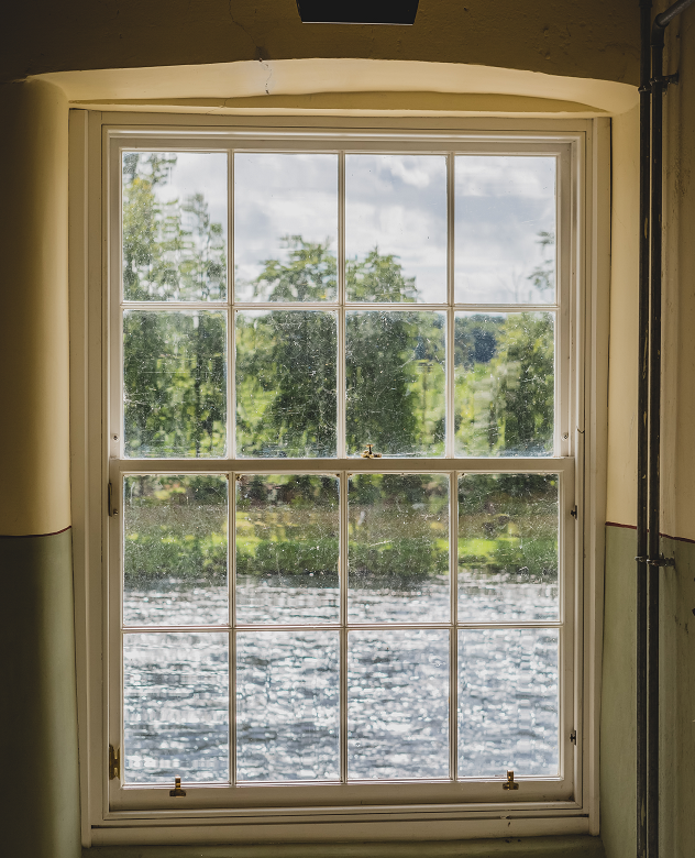 A view onto a river out of a mill window