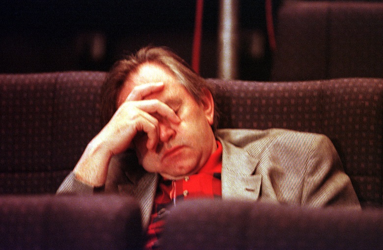 Bill Forsyth asleep in a seat at a vote count