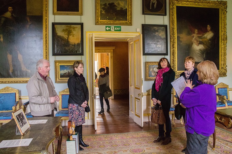 Visitors look at the paintings and antique furniture inside Duff House