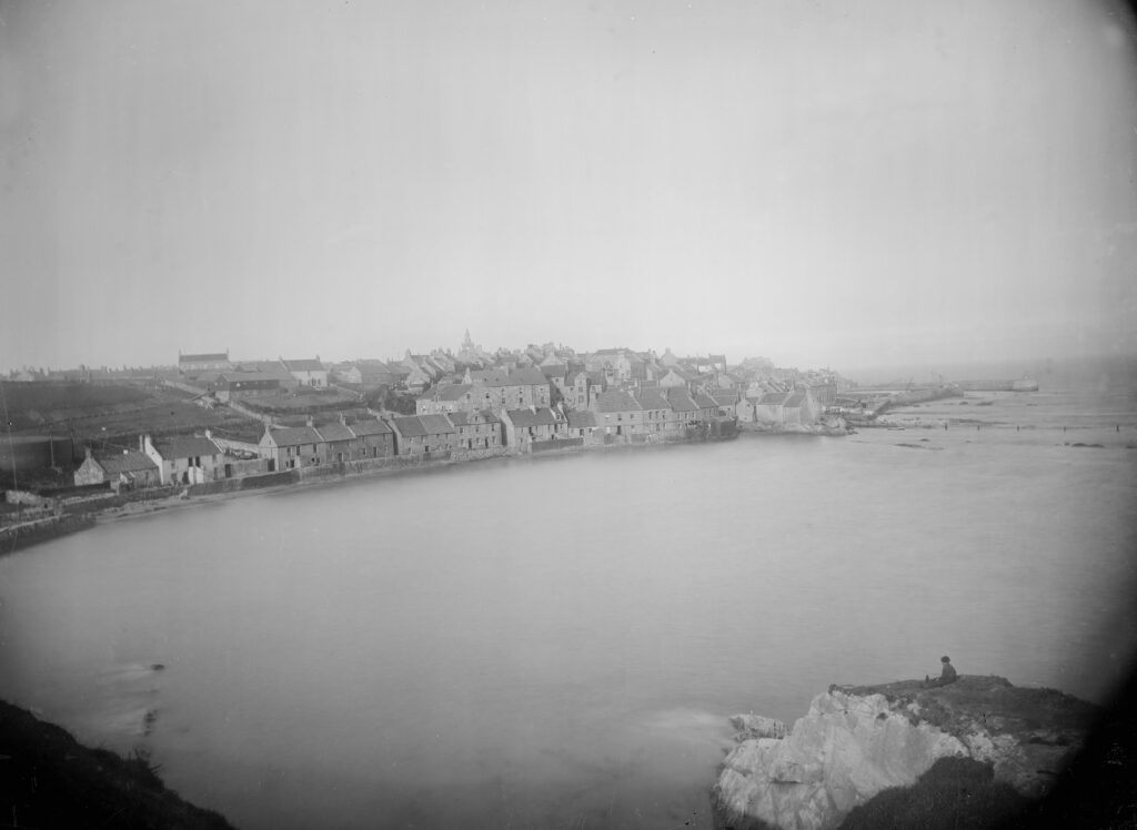 A black and white archive photo of Pittenweem harbour from the West