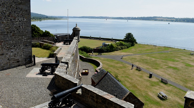 A view across a large river from the battlements of a castle