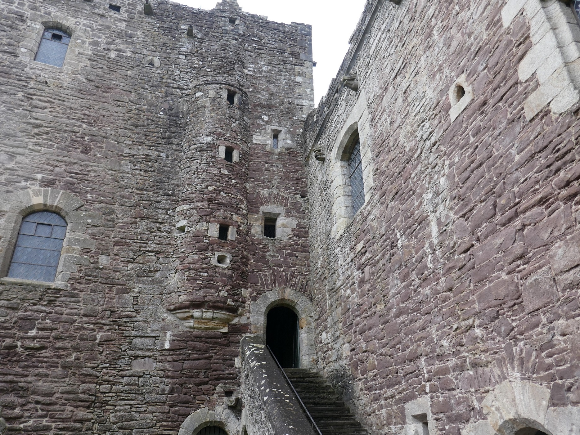 A close-up of Doune Castle with a staircase leading to the entrance