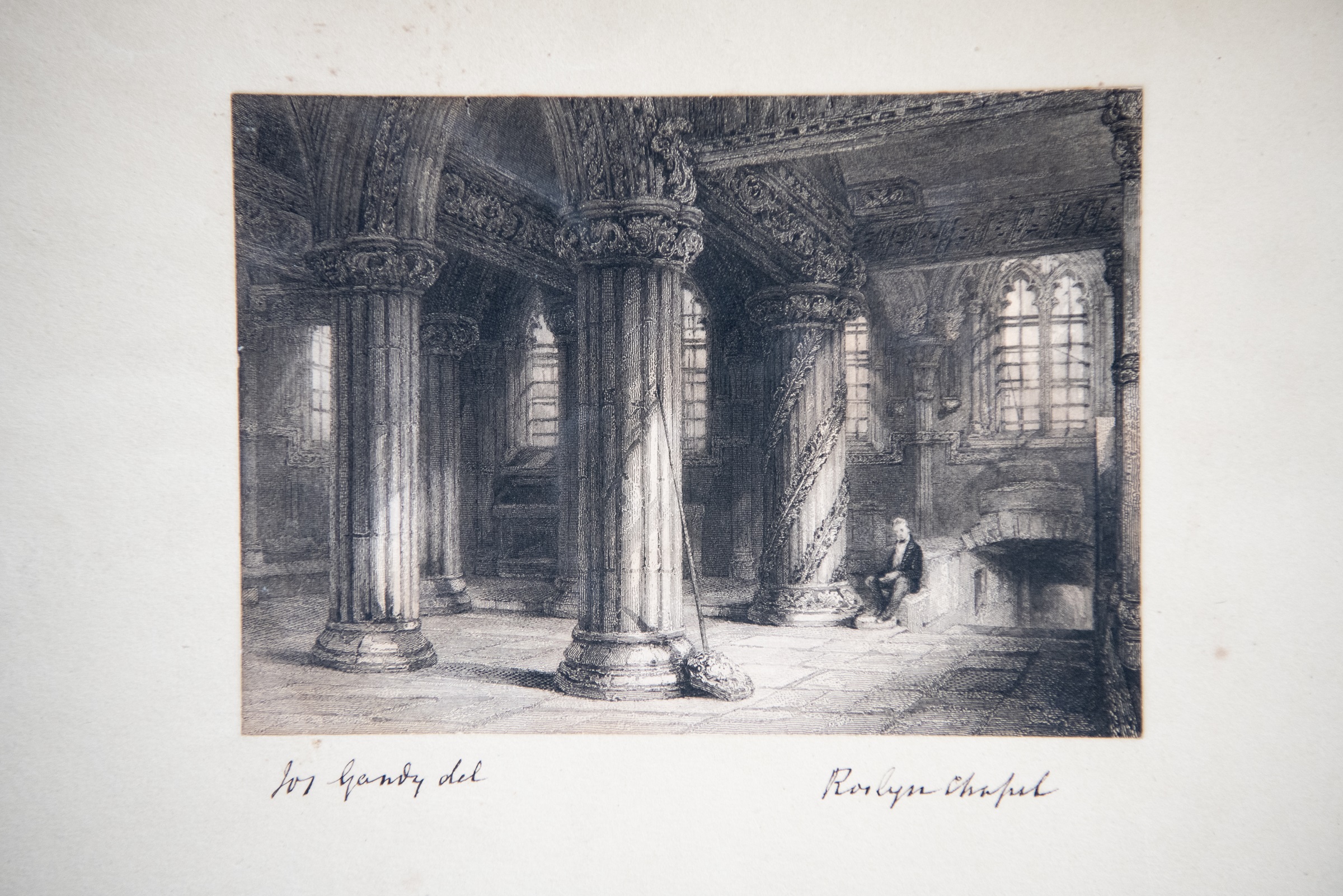 A black and white engraving showing four ornate pillars inside the chapel. 