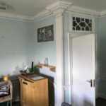 A slightly run-down looking space in a community centre but clues to its former life can be seen in impressive details like decorative columns at the corner of the room and in fanlights above the doors.