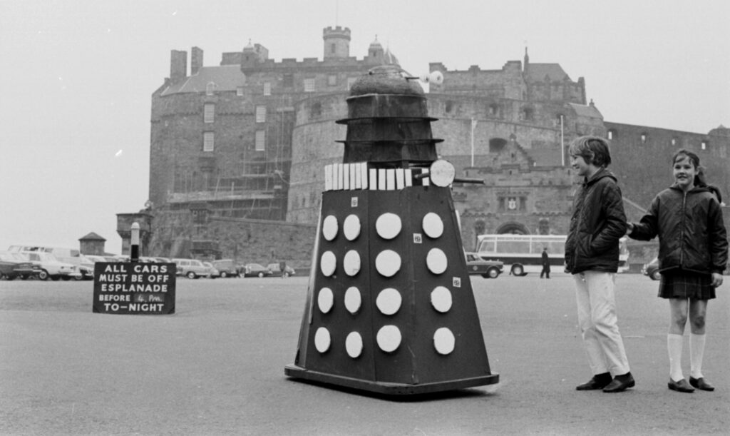 A black and white archive photo showing a Dalek at Edinburgh Castle.
