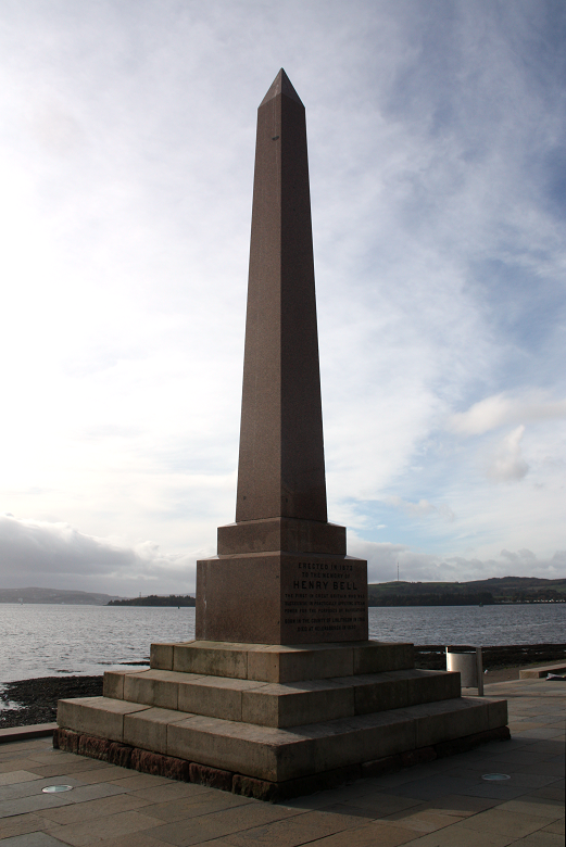 A simple but large grantie obelisk on pedestal. It stands on the side of the River Clyde and bears an inscription to Henry Bell. 