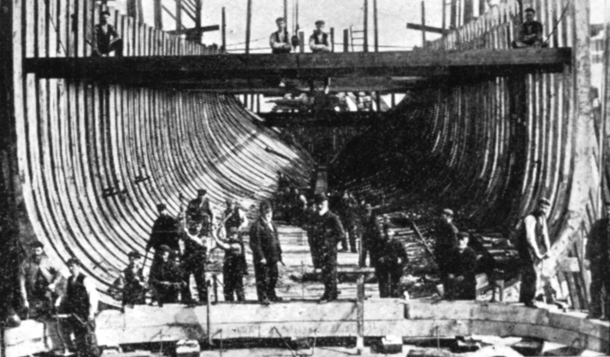 A black and white archive photo of the ship being built