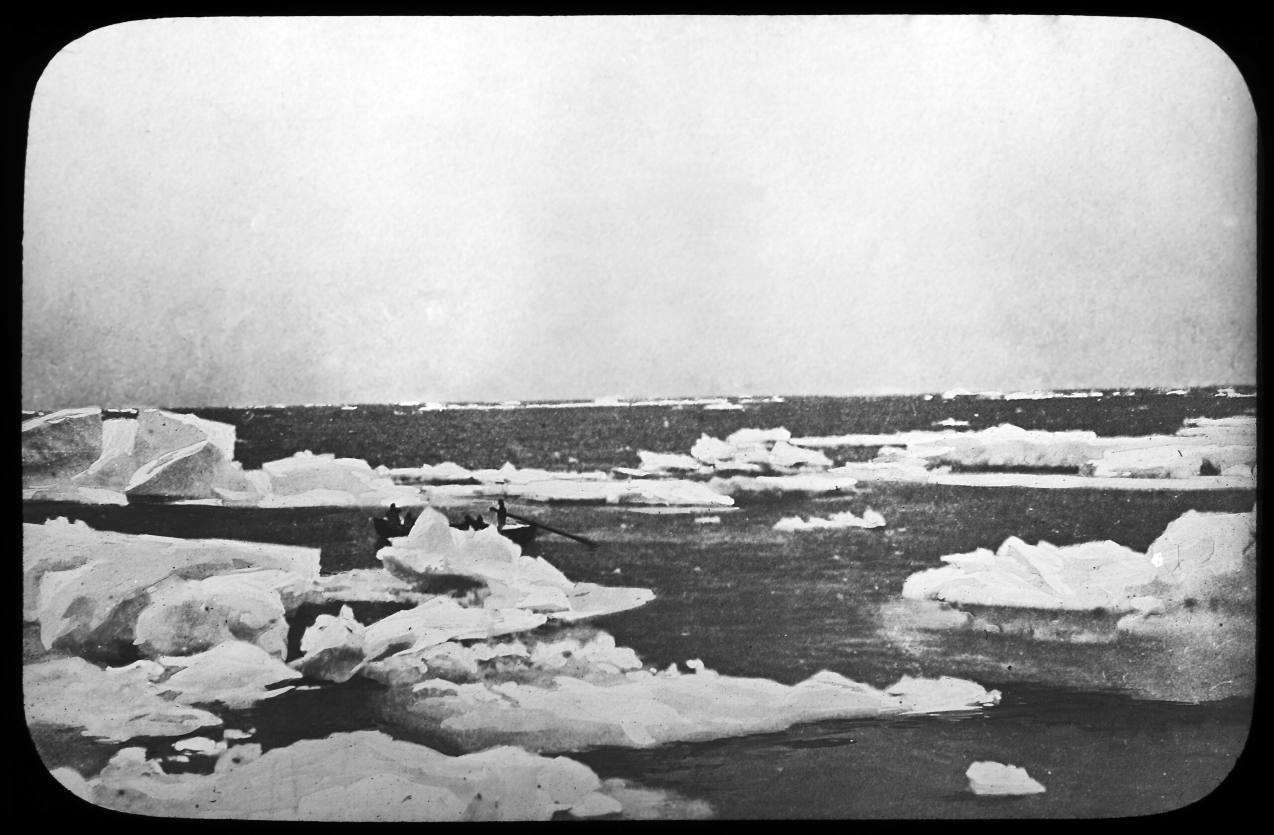 Black and white archive photo showing ice floating on water. It's Antarctica.