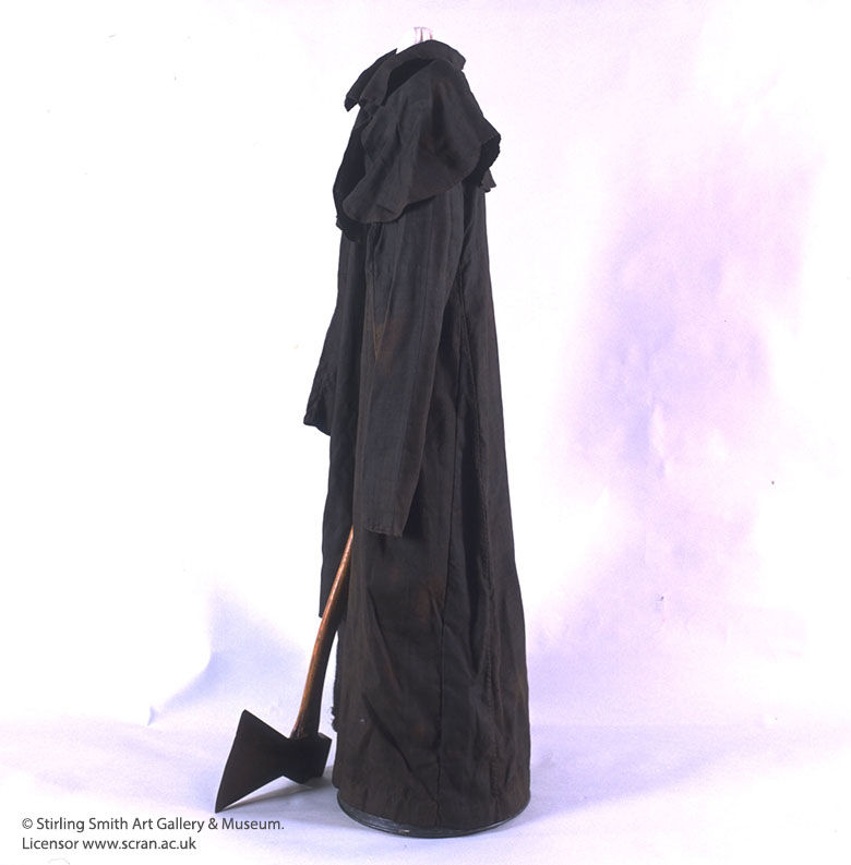 An image showing the black robe and axe of the executioner.
