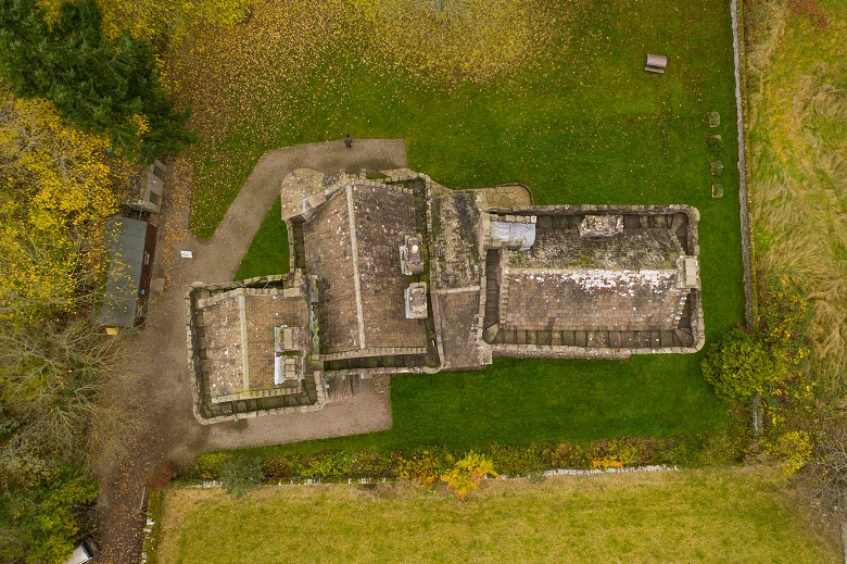 An aerial view of a castle showing how it is made up of two separate tower houses which have since been connected. 