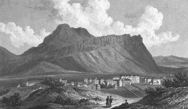An engraving showing Salisbury Crags in 1829. The volcanic rock rises high above the surrounding land. A small scattering of townhouses around 3 storeys tall can be seen in the middle distance, along with three figures walking through a pastoral landscape in the foreground.