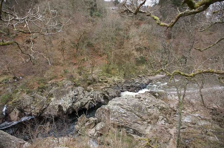 Wintry trees beside a narrow, rocky section of river where a soldier is said to have made a leap for safety. 