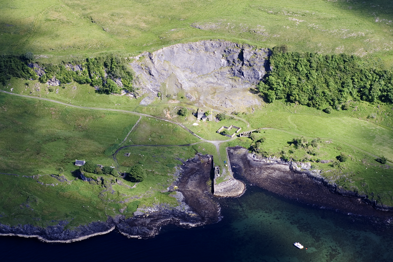An aerial view of a disused quarry close to the shoreline at An Sailean lime works. In contrast to its industrial past, the site is now very green and nature is beginning to reclaim it. 